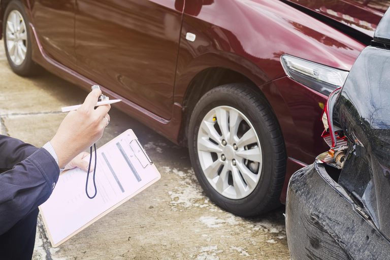 Insurance agent working on car accident claim process