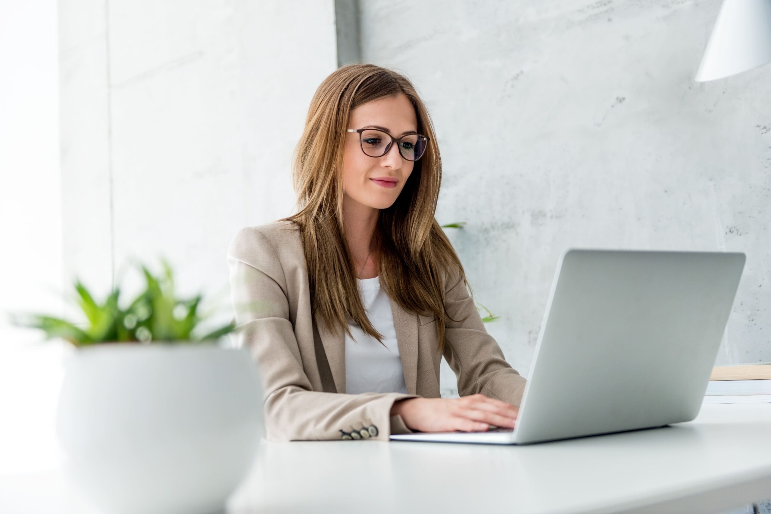 a woman working on her laptop