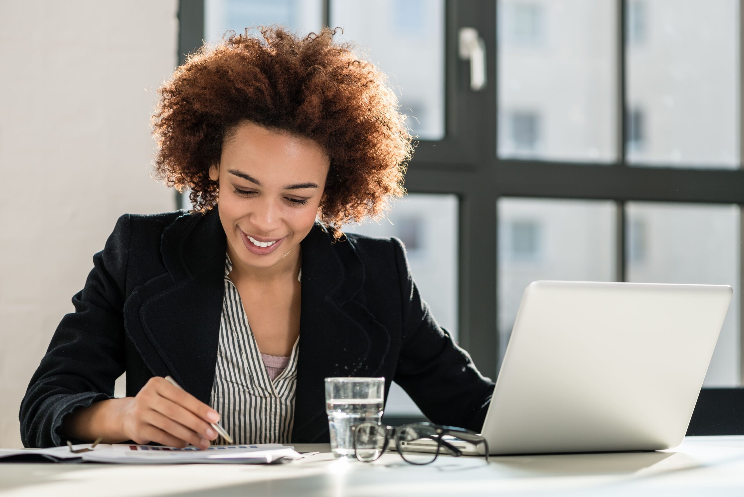 a female hiring manager checking a resume